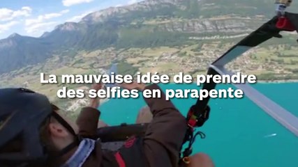 Elle fait tomber son iPhone lors d'un saut en parapente