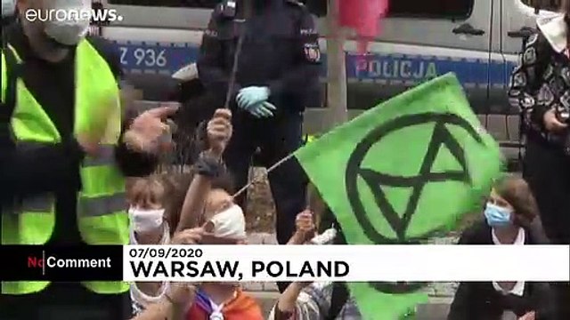 Extinction Rebellion activists block one of Warsaw's main streets