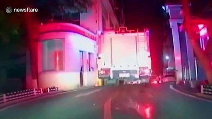 Fire engines force their way through illegally parked cars in China
