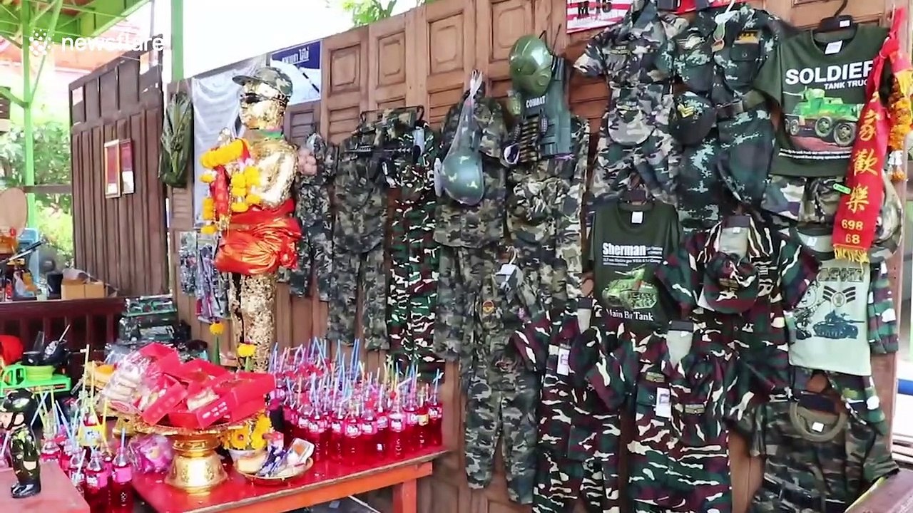 Superstitious locals light fire crackers at Buddhist temple for good luck