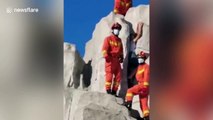 Chinese firefighters free teenaged boy who became trapped in artificial hill