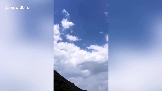 Thick smoke rises into air after rocket debris falls into Chinese village