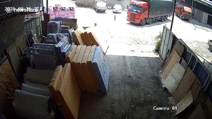 Chinese toddler escapes serious injury after being run over by truck