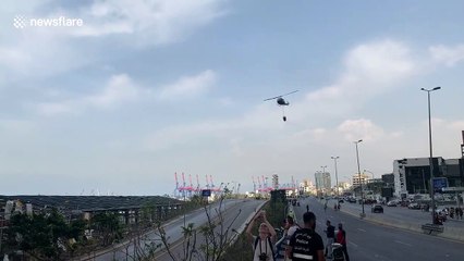 Helicopter drops water on huge blaze at Beirut port