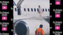 Graban en vídeo a una mujer andando sobre el ala de un avión porque tenía calor / They videotape a woman walking on the wing of an airplane because she was hot