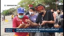 Komunitas Komunikasi Antar Media Bangkit Bagi-Bagi Masker Di Pantai Sanur