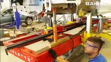 Celette Naja 3D measuring system used during car frame straightening process on a Celette car bench