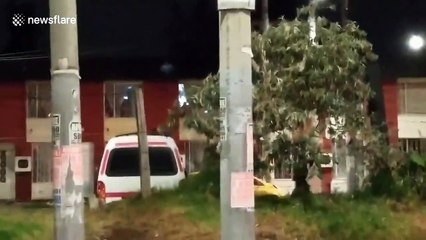 Angry residents chase away riot police during unrest in Bogota, Colombia