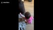 Sweet little girl tries and fails to help give her dog some food in Canada
