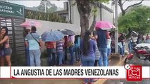 Madres venezolanas soportan largas filas para poder conseguir que les vendan leche