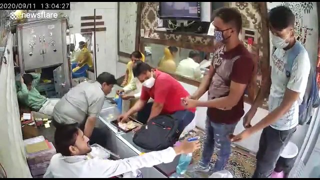 Bizarre moment armed robbers use hand sanitiser before snatching jewellery