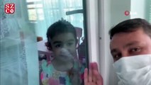 Koronavirüslü baba ile kızı, cam arkasından hasret giderdi