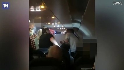 Shocking moment man on a flight to Turkey punches a woman