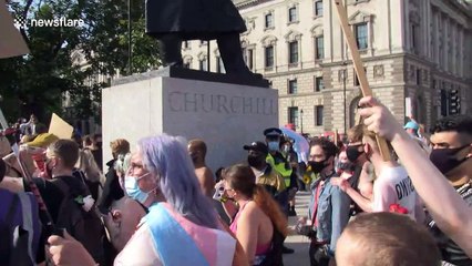 Police guard Winston Churchill statue as Trans Pride marchers arrive at Parliament Square