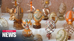 Ukrainian artist decorates egg shells with amber, metals, crystals