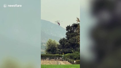 Helicopter collects water to fight Bobcat Fire in California