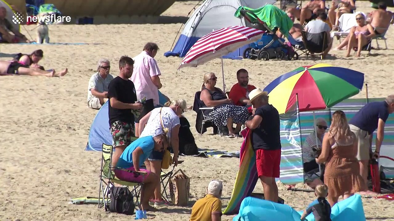 UK's late summer heatwave sees many hit the beach as 'Rule of Six' comes into effect