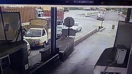 Truck loses control and rams into multiple vehicles at toll booth in southern India