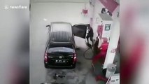 Car bursts into flames while being re-filled at petrol station in Indonesia