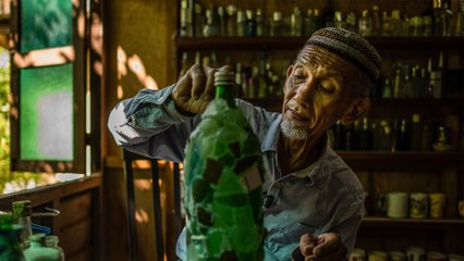 Malaysian grandfather turns glass waste on beaches into his own museum exhibits