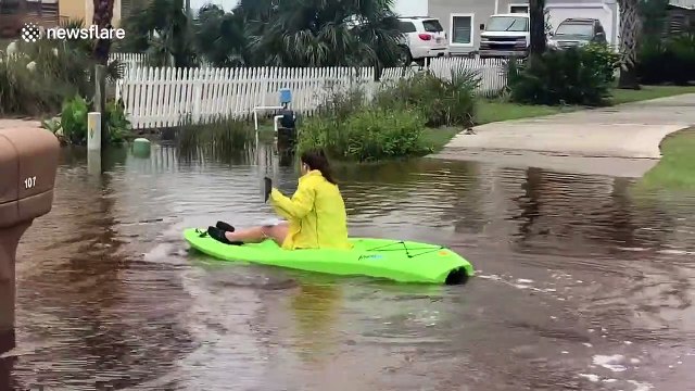 Florida family has fun during Hurricane Sally kayaking in front yard of flooded streets