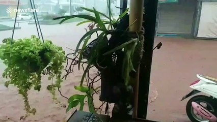 Flash floods wash motorcycle away in southern Thailand