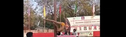 Boy Twists His Flexible Body Around Pole While Performing Mallakhamba