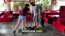 Florida Residents Break From Sally Cleanup, Kneeboard Down Flooded Street