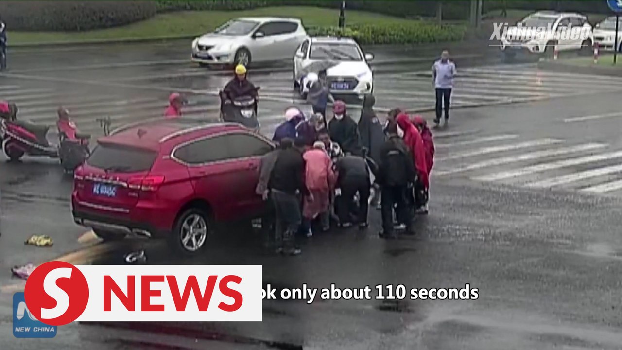 Passers-by in China lift car to save elderly man pinned underneath