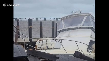 Fishing yacht breaks loose and slams into marina at Florida's Navarre during Hurricane Sally