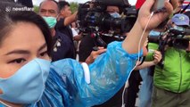 Thai protesters break police barricade to storm scared royal field