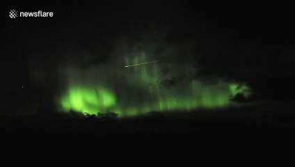 Bright pink meteor flies across Northern Lights in stunning video