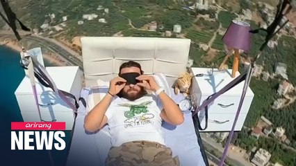 Turkish paraglider takes nap on bed while flyin