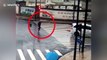 Chinese biker narrowly avoids serious injury after being crashed into by car