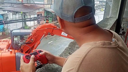 Construction Worker Uses Gaming Controller for Work