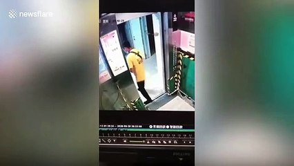 Chinese delivery man breaks lift doors after using cardboard box to prevent them from closing