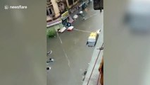 Flooded streets and vehicles submerged as Mumbai hit by heavy rainfall