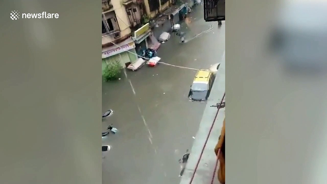 Flooded streets and vehicles submerged as Mumbai hit by heavy rainfall