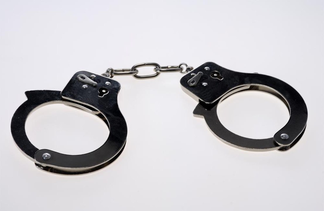 Police free man trapped in handcuffs
