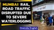 Mumbai: Waterlogging, rail & road traffic disrupted after heavy rainfall | Oneindia News
