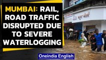 Mumbai: Waterlogging, rail & road traffic disrupted after heavy rainfall | Oneindia News