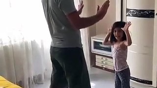 A girl playing with her father, see it's very fun
