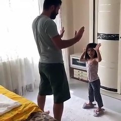 A girl playing with her father, see it's very fun