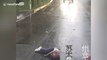 Helmet saves biker's life after he is run over by truck on Chinese road