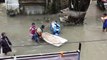 Kids play in flooded streets of Mumbai during torrential monsoon
