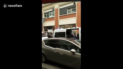 Row of police vans line street near scene of Paris knife attack