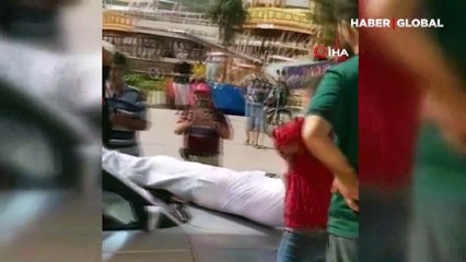 Emekli astsubay ilçe meydanında kılıçla intihar girişiminde bulundu