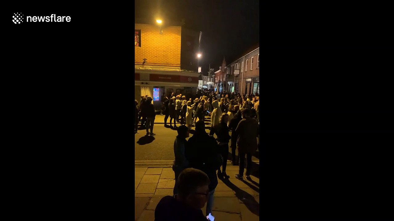 UK drinkers take party to the street after pubs close at 10 pm