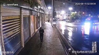 Chinese pedestrian narrowly avoids being hit by truck smashing into shop