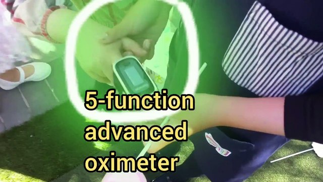 a smart 7-year-old runs the Triage at Vancouver General Hospital-ity, infrared thermal imager temperature checks, blood oxygen, perfusion index, heart rate, pleismograph, fever symptom scan on the wrist, assisted by a Vancouver Thermographer.